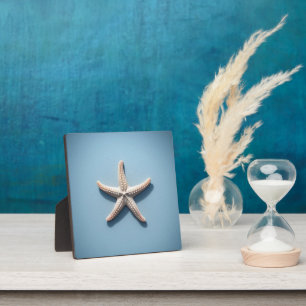 Plaque Photo Étoile de mer exotique avec fond bleu