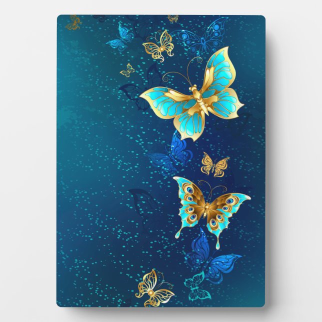 Plaque Photo Papillons d'or sur un Arrière - plan bleu (Devant)