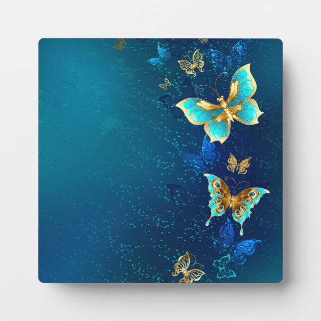 Plaque Photo Papillons d'or sur un Arrière - plan bleu (Devant)