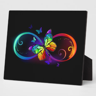 Plaque Photo Vibrant infinity with rainbow butterfly on black