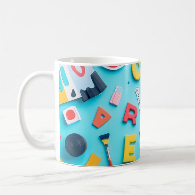Plastic letters arranged artistically on a dark bl coffee mug (Left)