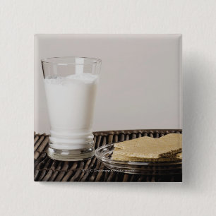 Plate of snacks with a glass of milk 2 inch square button