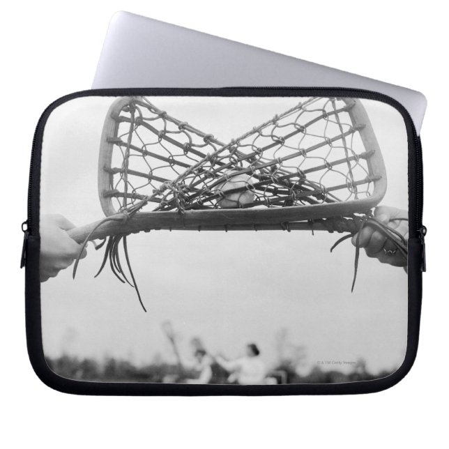 Play starts in a lacrosse team with the draw.Two Laptop Sleeve (Front)