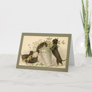 Playful daschunds with holly berry and vase holiday card