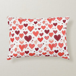 Playful hand drawn red hearts pattern on white accent pillow