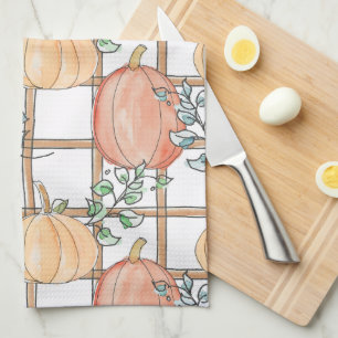 Playful pumpkin and plaid kitchen towel