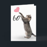playful tabby cat for 60th birthday card<br><div class="desc">Grey tabby cat with pink heart balloon for 60th birthday on white background.
Background colour can be changed</div>