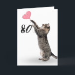 playful tabby cat for 80th birthday card<br><div class="desc">Gray tabby cat with pink heart balloon for 80th birthday on white background.
Background color can be changed</div>