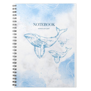 Playful whales in the ocean notebook