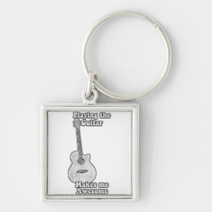 Playing the guitar makes me awesome. black & white keychain