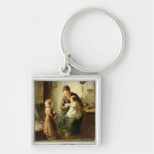 Playing with baby, 19th century keychain