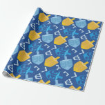 Pleasant Dreidel Hanukkah Wrapping Paper<br><div class="desc">If you love nice quality heavy duty wrapping paper, you will love this item. Displaying a pleasant Hanukkah design with blue and gold dreidels, the images are shown on a blue background. There are Hebrew letters. Purchase your Hanukkah wrapping paper today!
Hanukkah pattern design: AMBillustrations
http://www.etsy.com/shop/AMBillustrations/</div>