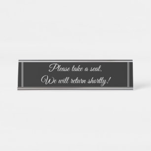 "Please take a seat. We will return shortly!" Desk Name Plate