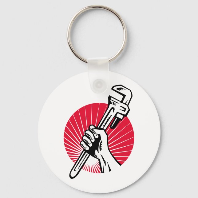 Plumber hand holding pipe wrench woodcut keychain (Front)