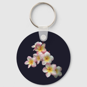 Plumeria blossoms on dark blue keychain