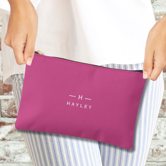 Pochette À Accessoires monogramme chic rose chaud (Hot pink monogram accessory pouch being held by a woman's hands)
