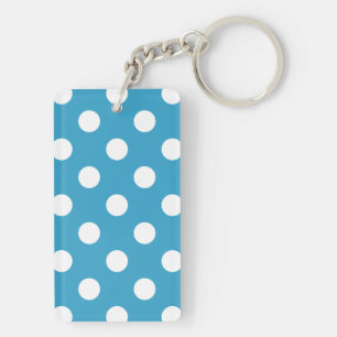 Points blancs sur fond bleu paon