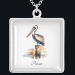Poise of the Pelican Silver Plated Necklace<br><div class="desc">Carry the calm of the coast close to your heart with this silver-plated necklace featuring the Poise of the Pelican design. The delicate pendant showcases a serene watercolor scene of a pelican perched on a weathered dock post, evoking peaceful seaside moments and a love for nature. The design is set...</div>