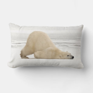 Polar bear scratching itself on frozen tundra lumbar pillow