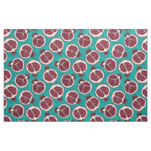 Pomegranate slices on turquoise fabric