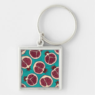 Pomegranate slices on turquoise keychain