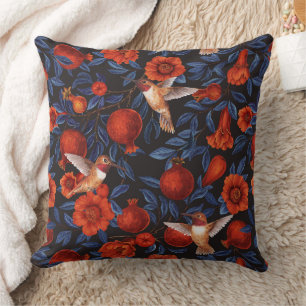 Pomegranates and hummingbirds/blue leaves on black throw pillow