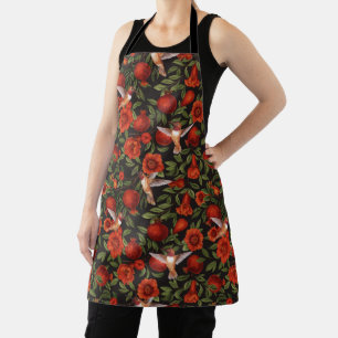 Pomegranates and hummingbirds/green leaves on blac apron