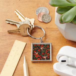 Pomegranates and hummingbirds/green leaves on blac keychain
