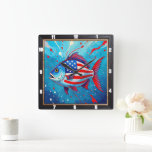 Pop Art Patriotic Fish  Square Wall Clock<br><div class="desc">This vibrant wall clock features a unique pop art style fish, boldly adorned with the American flag's stars and stripes against a dynamic blue background with red splatters. This artistic timepiece is a playful yet patriotic addition to any home decor, offering a colourful and modern statement piece that celebrates both...</div>