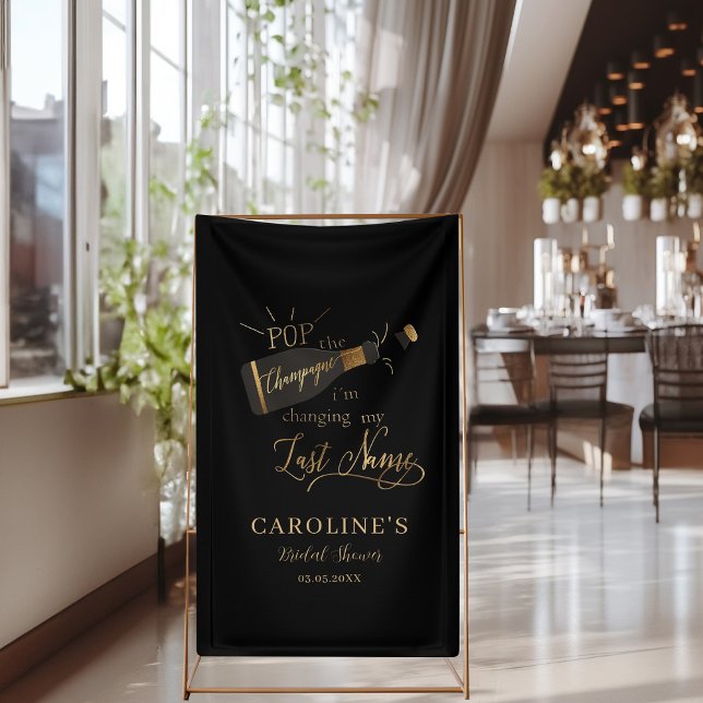 Pop the champagne i´m changing my last name!  banner ("Pop the champagne, i´m changing my last name!" Black & Gold, Bridal Shower Banner.)