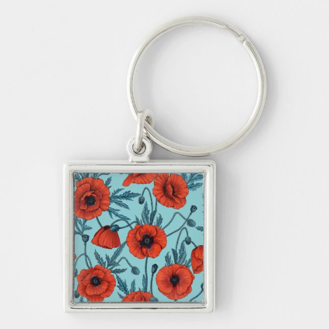 Poppies, red and blue on pool blue keychain (Front)
