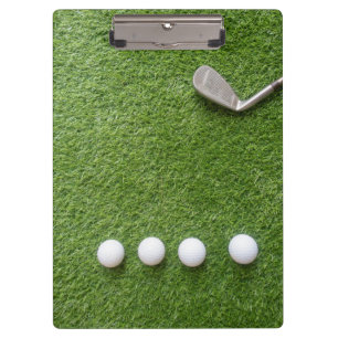 Porte-bloc Les balles de golf sont sur le cahier vert