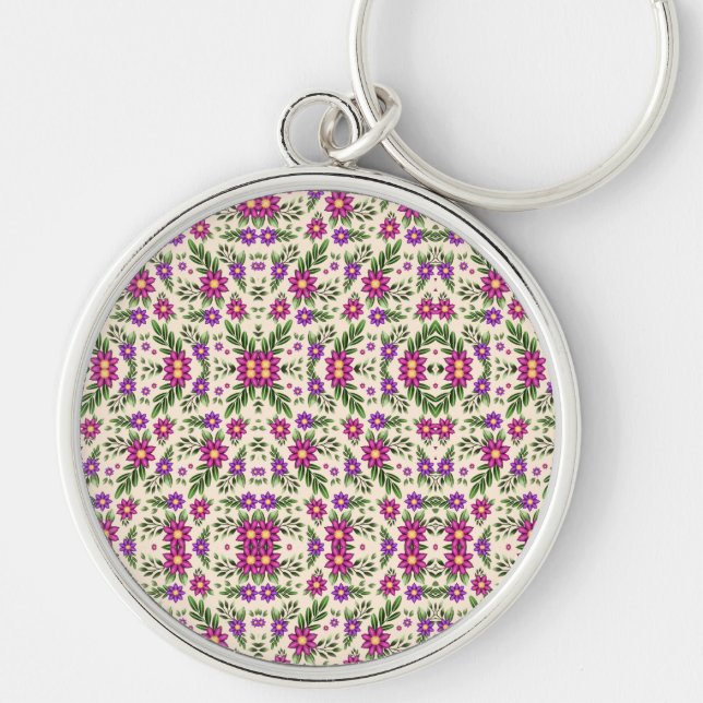 Porte-clés A round keychain features a detailed floral  (Devant)