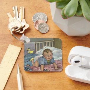 Porte-clés Bébé mignon vintage jouant dans un berceau, heure
