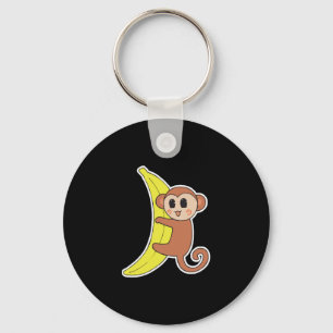 Porte-clés bébé singe mignon sur une banane