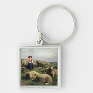 Porte-clés Bergère avec des moutons dans un paysage