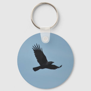 Porte-clés Black Raven Flying in Blue Sky Photo