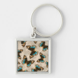 Porte-clés Bleu motif papillon Pansy sur blanc