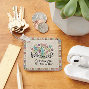 Porte-clés Bonté de Dieu look matelassé floral musique