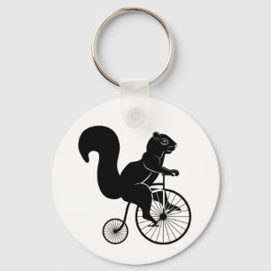 Porte-clés Cavalier d'écureuil sur le vélo vintage
