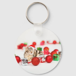 Porte-clés Chat portant un ornement de Noël au chapeau rouge 