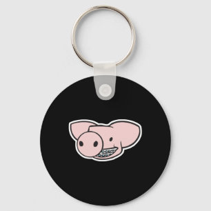 Porte-clés cochon souriant avec un appareil dentaire