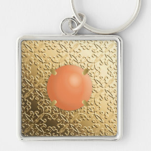 Porte-clés Damas d'or avec gemstone de faux corail