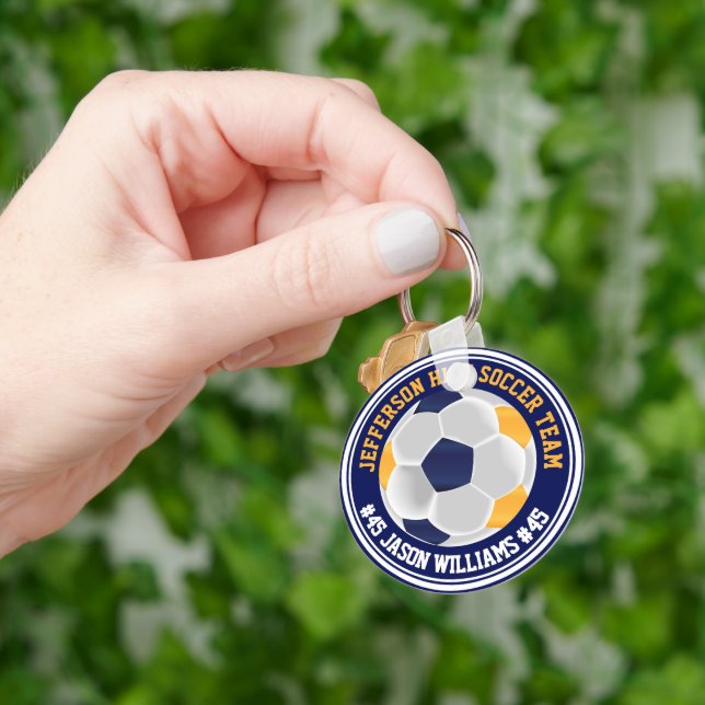 Porte-clés ⚽ de football bleu et or de la Marine (main)