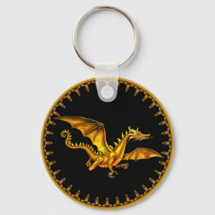 Porte-clés dragon d'or de vol sur le noir