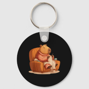 Porte-clés Drôle de capybara tricotant sur un canapé pour adu