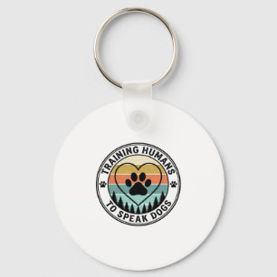 Porte-clés Entraîner les Humains à Parler aux Chiens Badge de