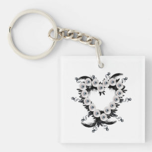 Porte-clés Forme de coeur en plume et perle noire 