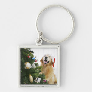 Porte-clés Golden retriever qui observe l'arbre de Noël