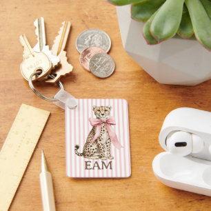 Porte-clés Guépard au nœud rose et monogramme à rayures
